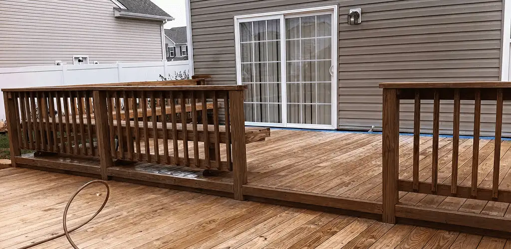 Deck sealing service protecting a backyard wood deck and railings in Sterling Heights, MI