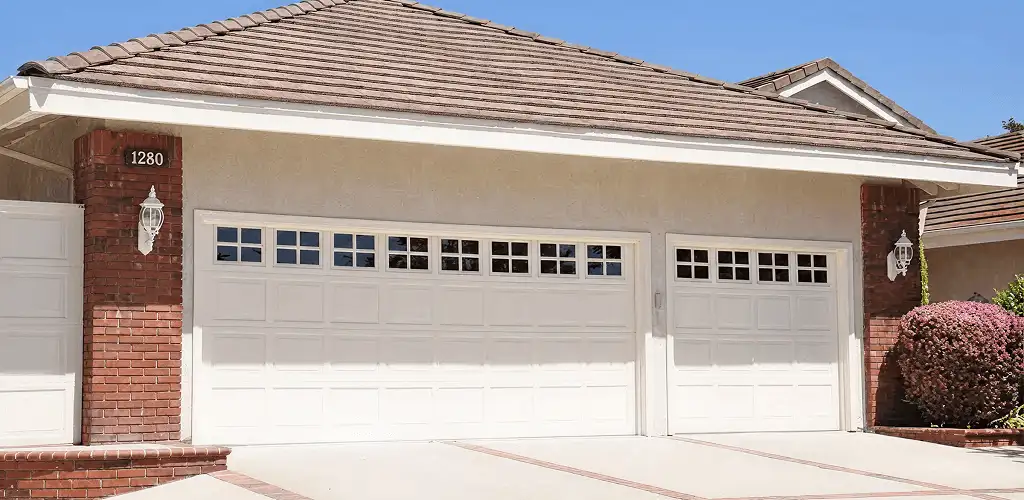 Residential garage door repair service for a double garage door in Sterling Heights, MI